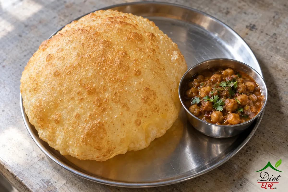 Bhatura, photographed as one large puffed golden bhatura, in a home kitchen