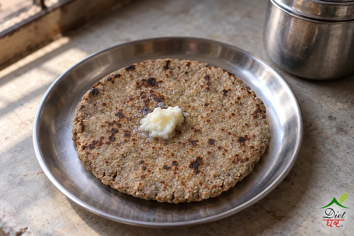 Bajra roti, photographed as one thick rustic bajra roti, in a home kitchen
