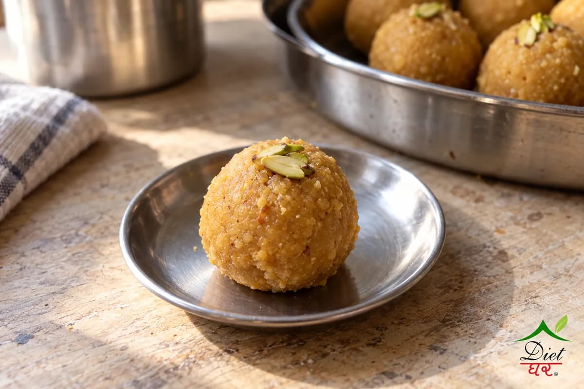 Besan laddu, photographed as one golden besan laddu, in a home kitchen