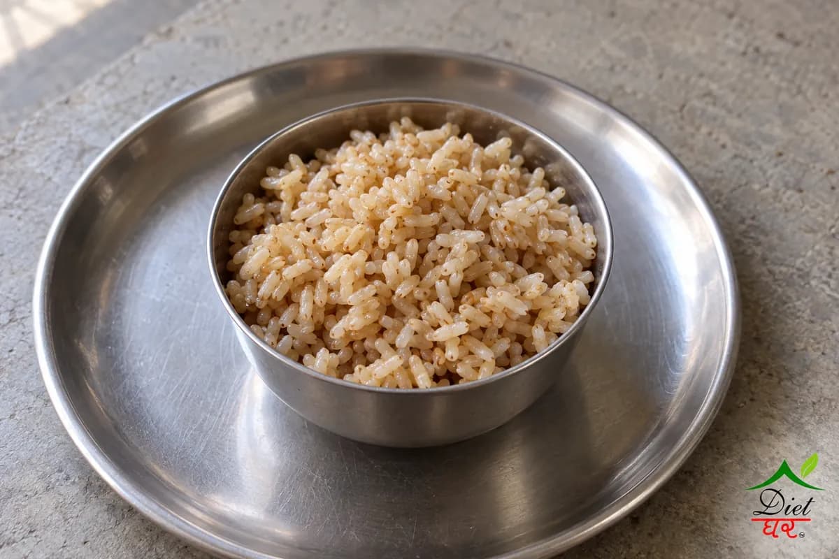 Brown rice, photographed as one steel katori of cooked brown rice, in a home kitchen