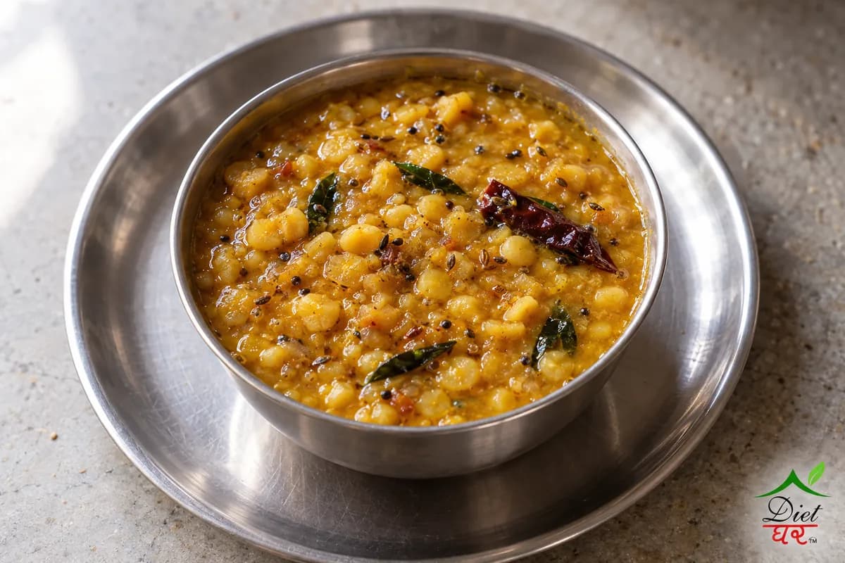 Chana dal, photographed as one steel katori of thick golden chana dal, in a home kitchen