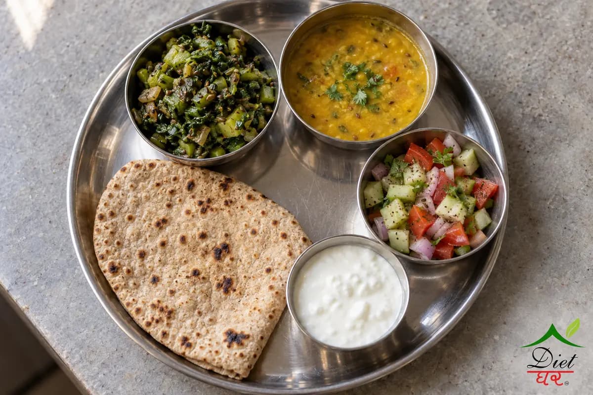 A balanced Indian thali with roti, a green sabzi, dal, kachumber salad and curd, seen from above