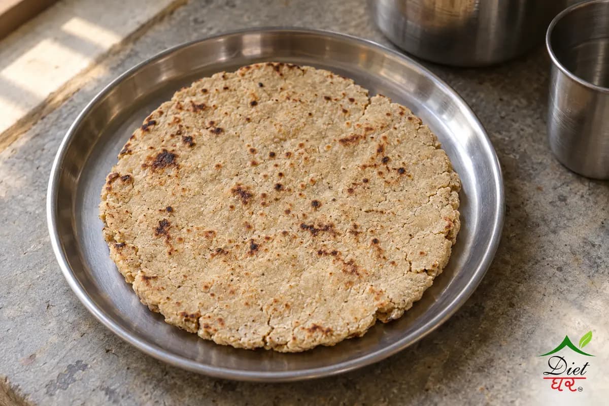 Jowar roti, photographed as one thick rustic jowar roti, in a home kitchen