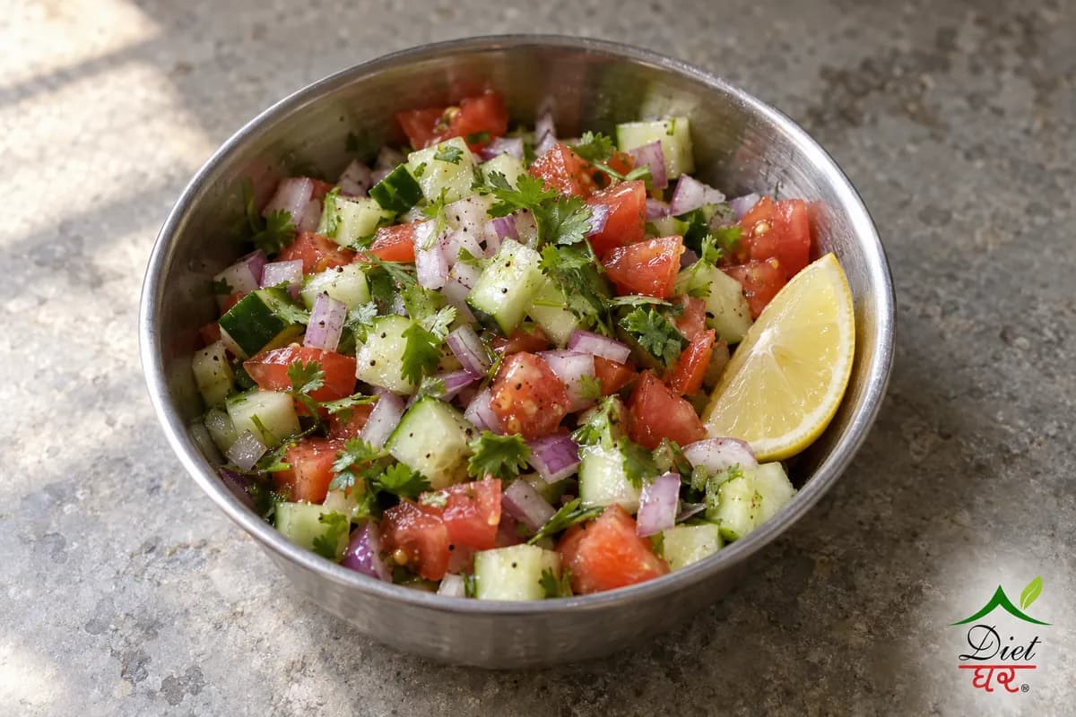 Kachumber salad of cucumber, tomato and onion in a steel bowl