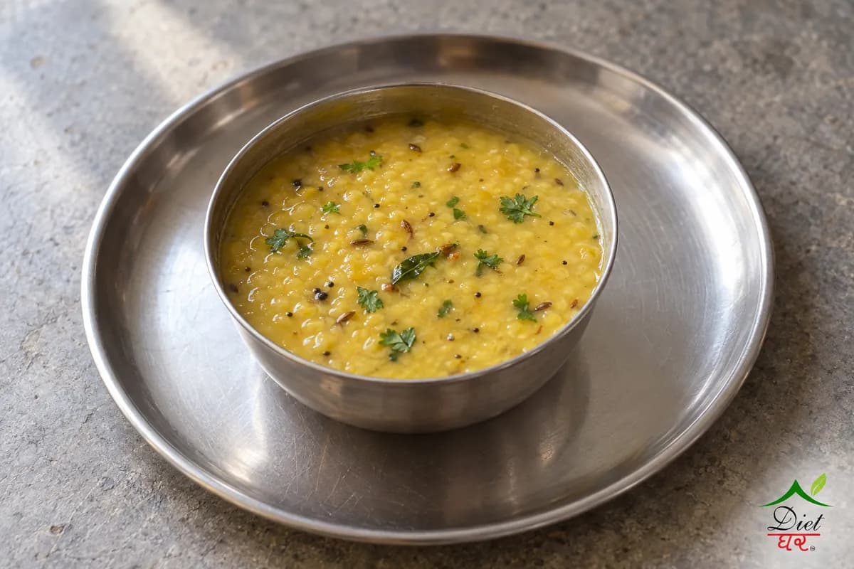 Moong dal, photographed as one steel katori of light yellow moong dal, in a home kitchen