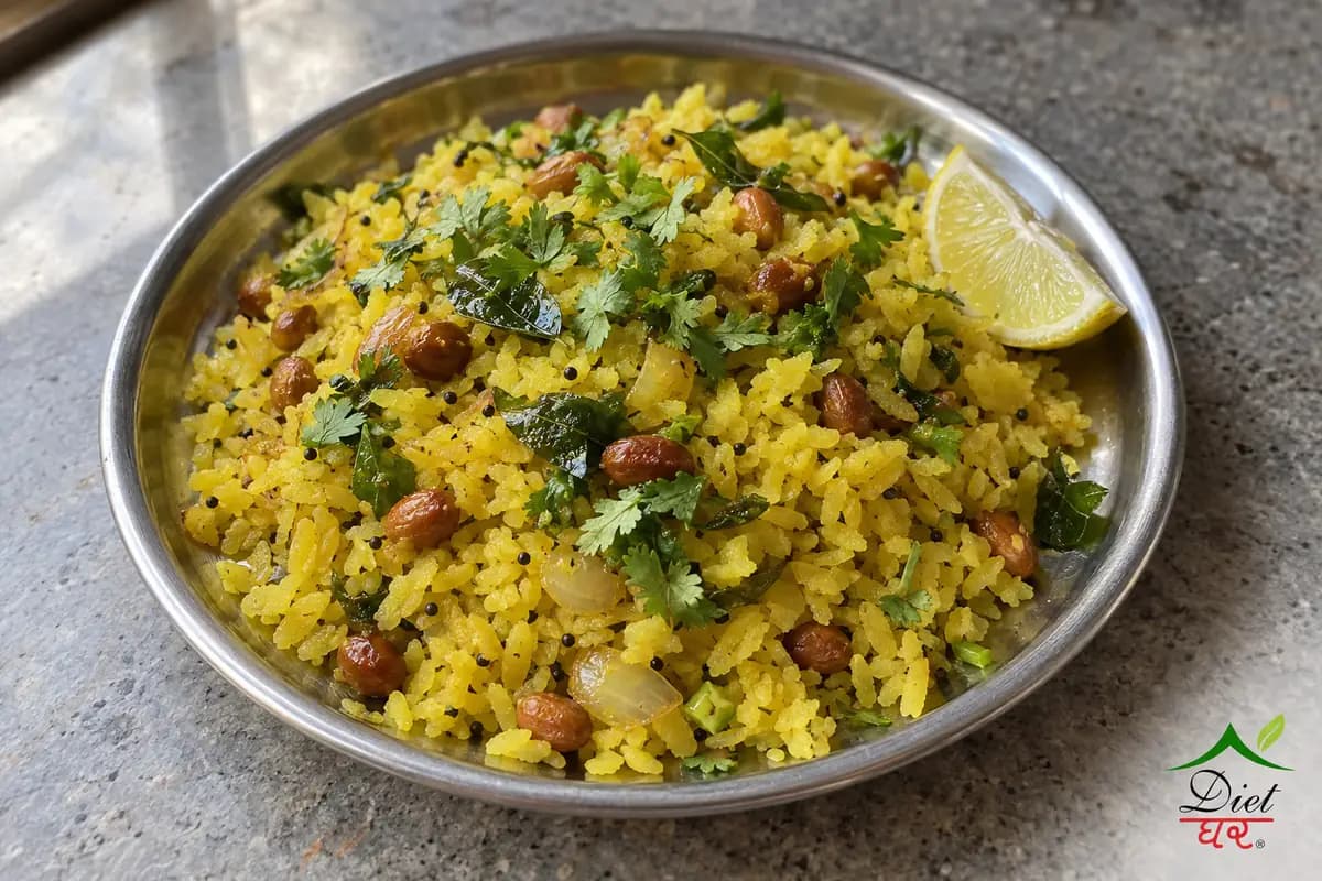 Poha with peanuts, curry leaves and a lemon wedge on a steel plate