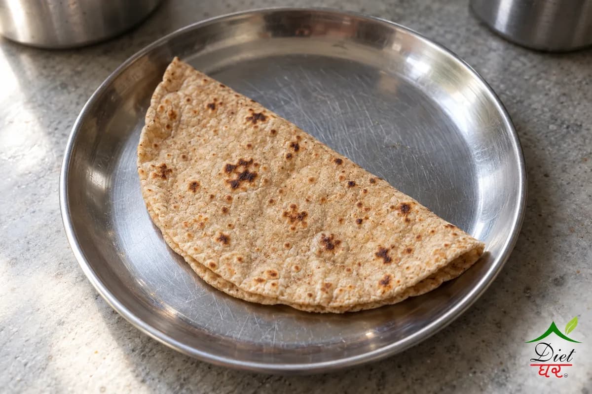Roti (chapati), photographed as one plain round whole wheat roti (chapati), in a home kitchen