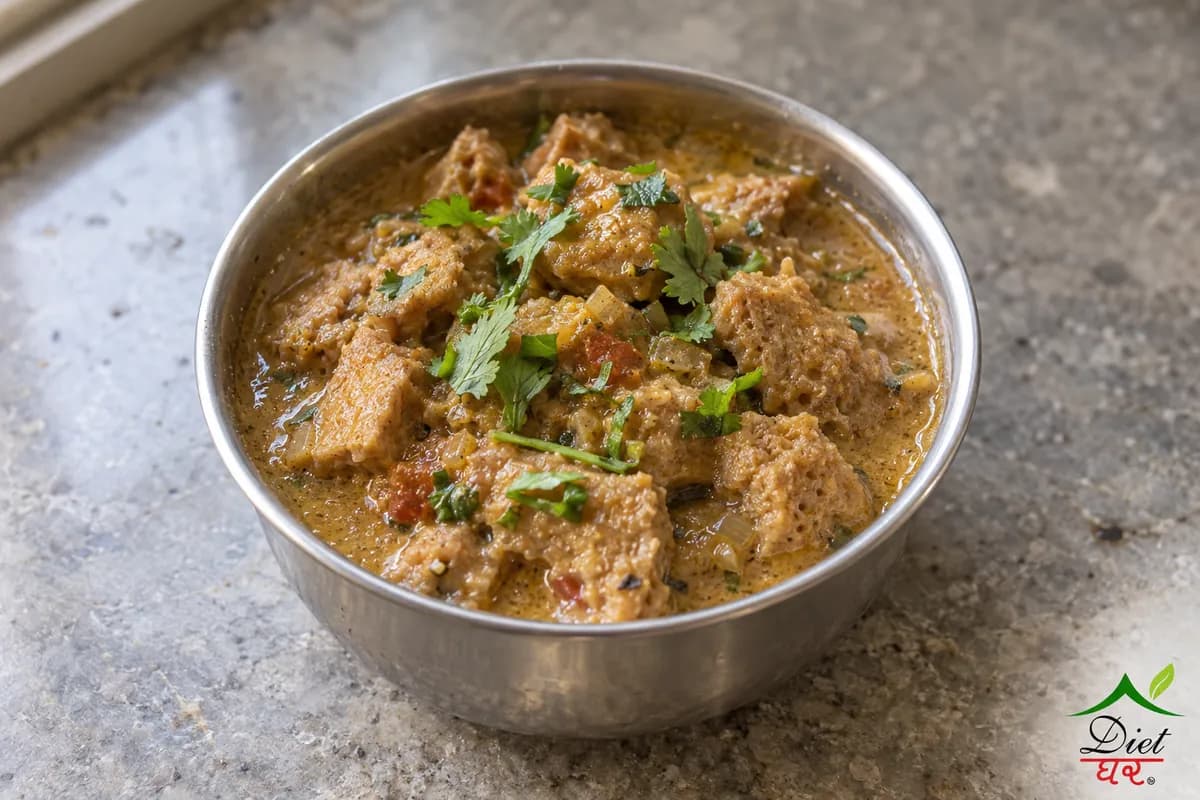Cooked soya chunk curry in a small steel katori