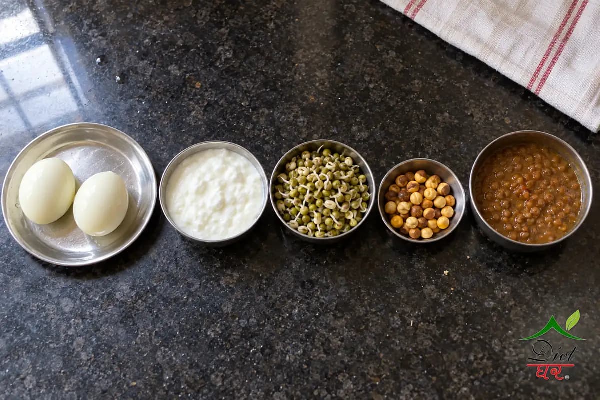 What a portion looks like: two boiled eggs, a katori of curd, sprouted moong, a handful of roasted chana and a katori of dal